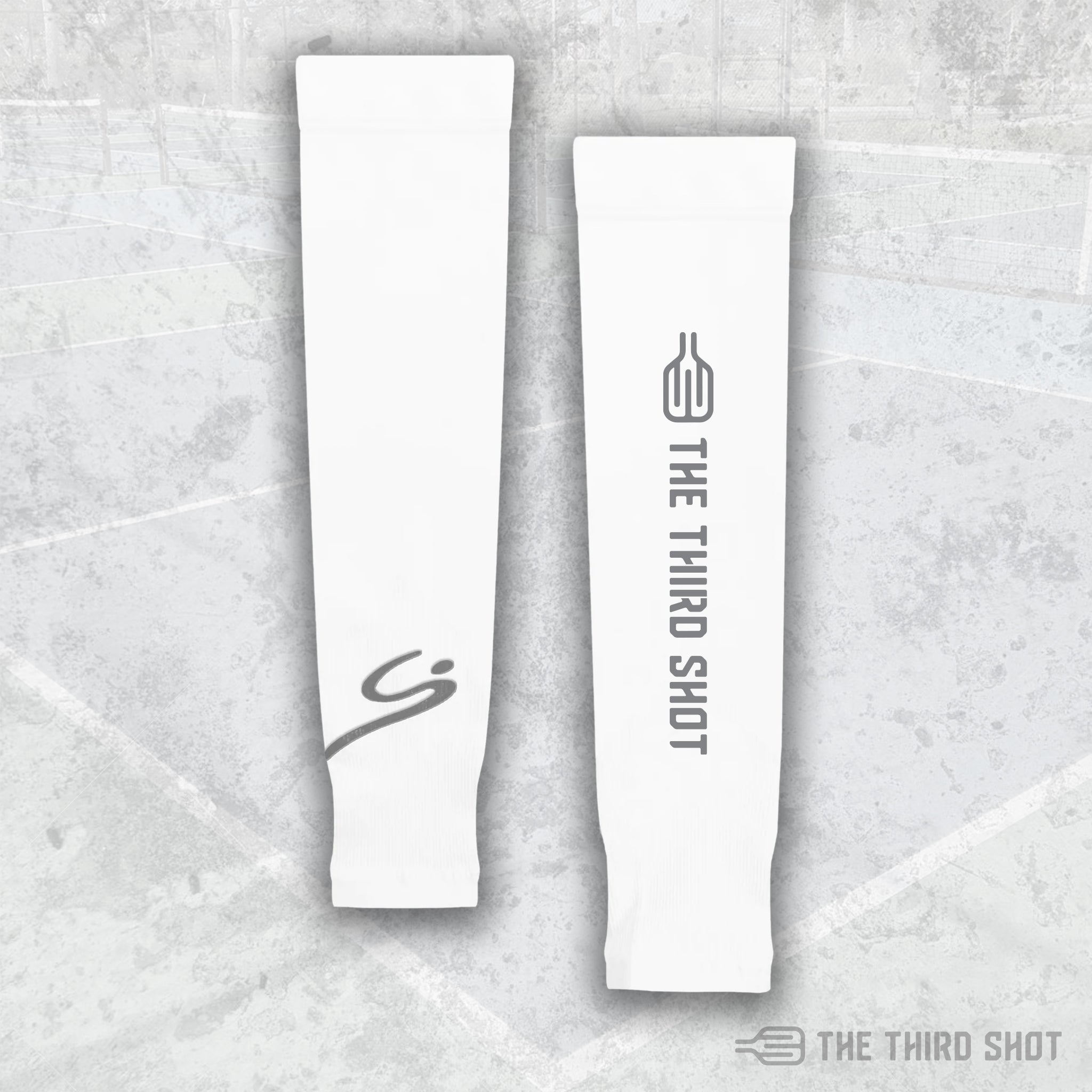 The Third Shot pickleball sun sleeves in grey, lightweight UV protection sleeves with subtle logo detail, designed for outdoor pickleball players.