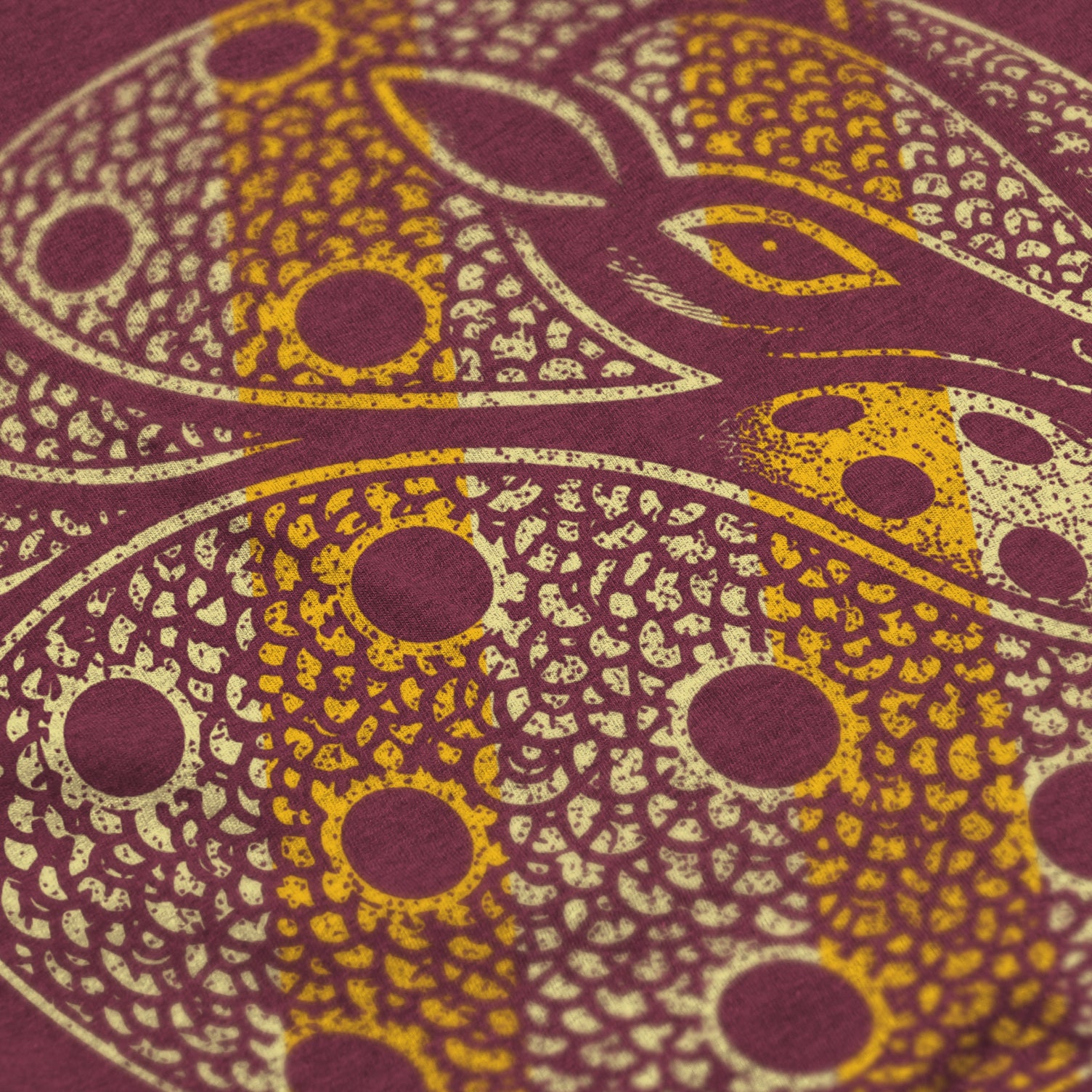 Close-up of Armor pickleball shirt in maroon – armadillo graphic detail on back