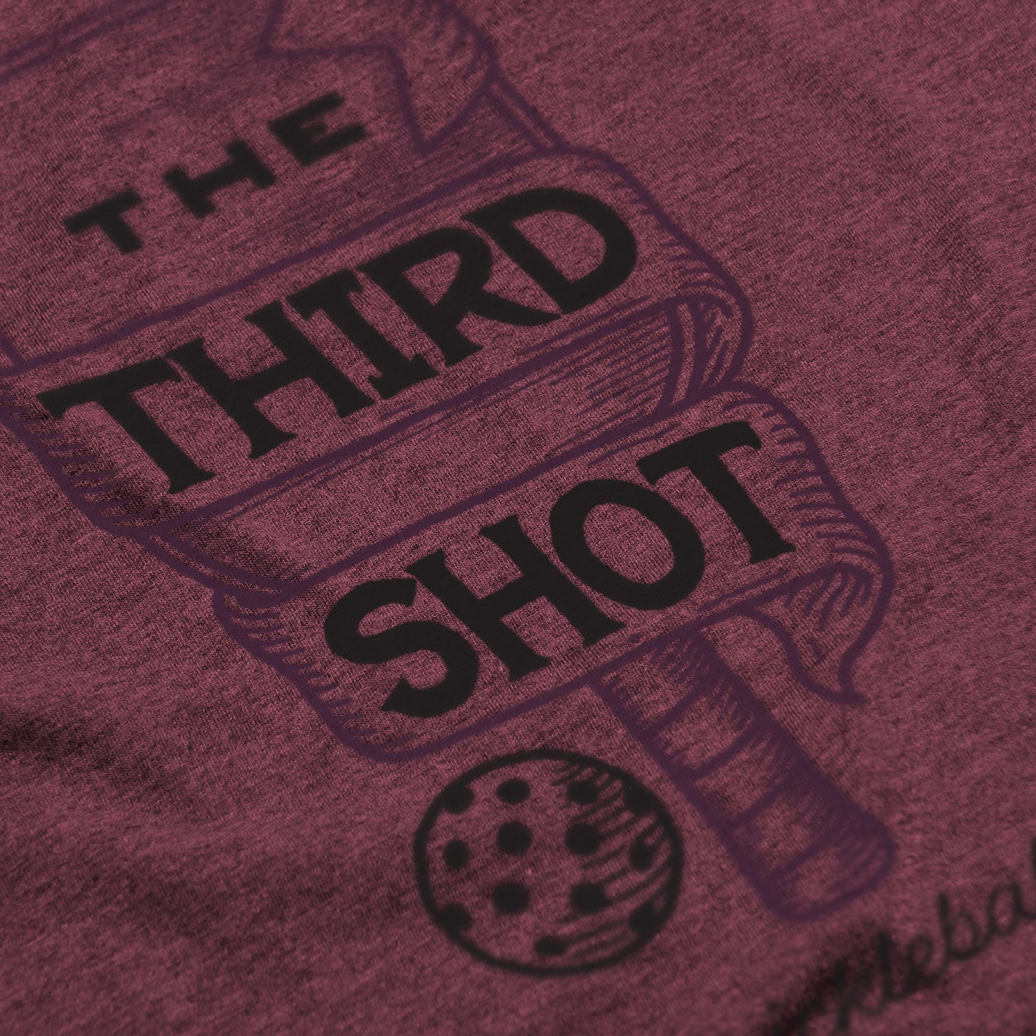 Close-up of Foundry pickleball shirt in lush – wood cut old fashioned paddle graphic detail on back
