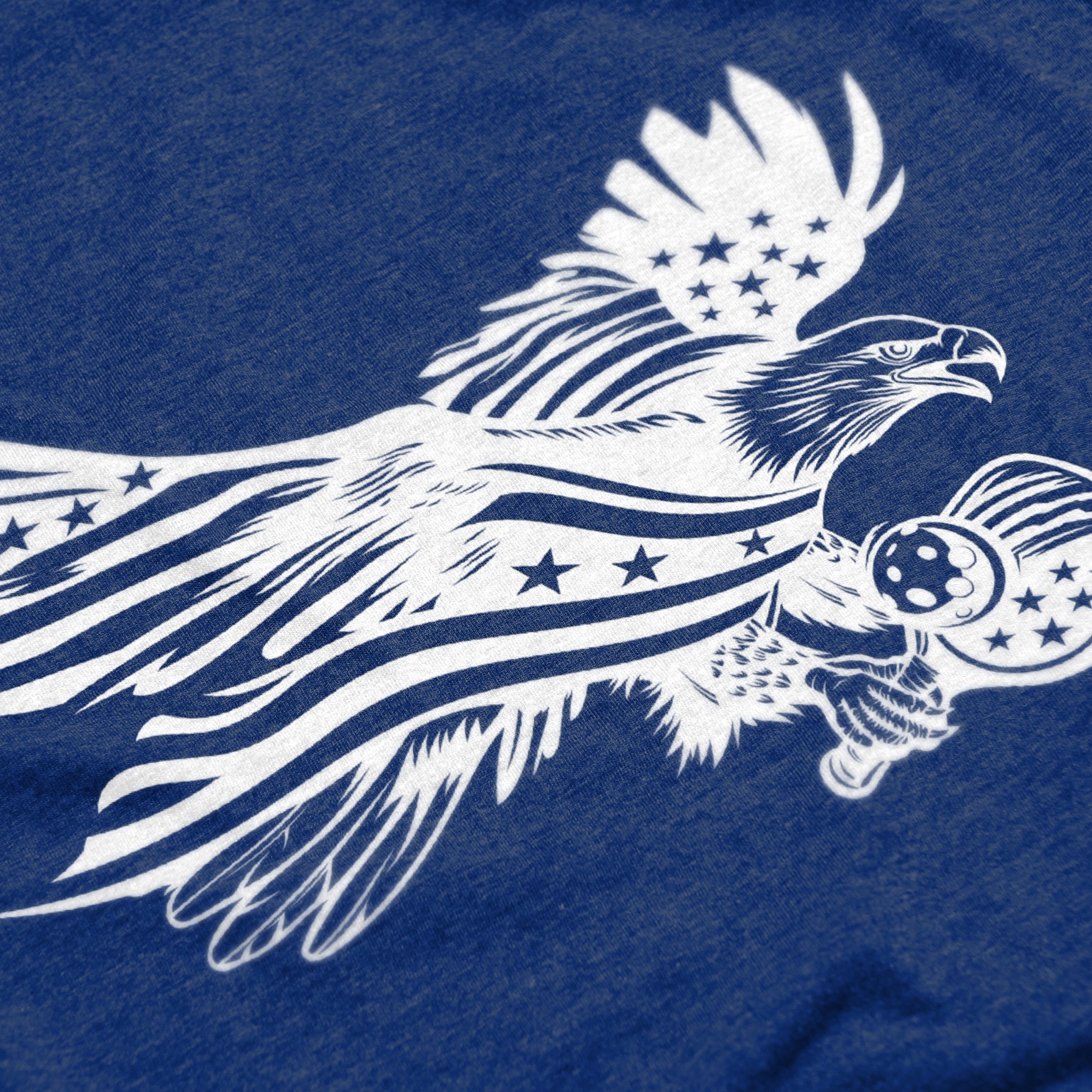 Close-up of Soar pickleball shirt in royal blue – patriotic eagle flag graphic detail on chest
