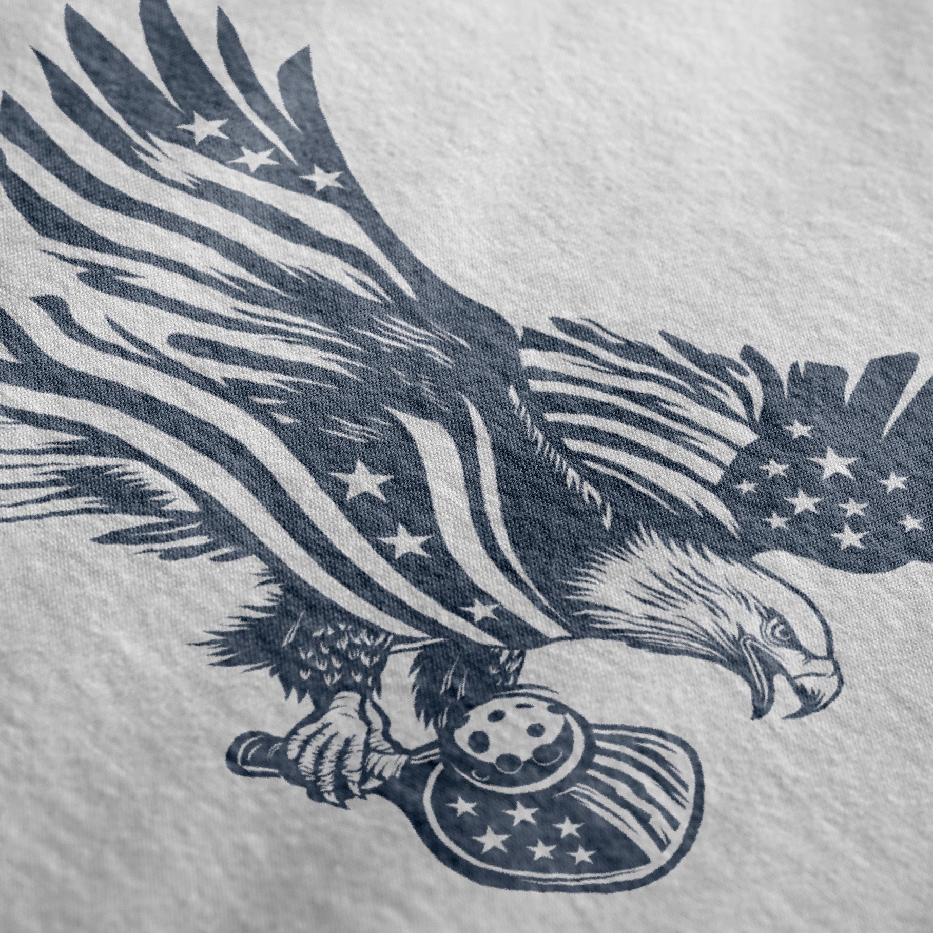 Close-up of Soar pickleball shirt in white – patriotic eagle flag graphic detail on chest
