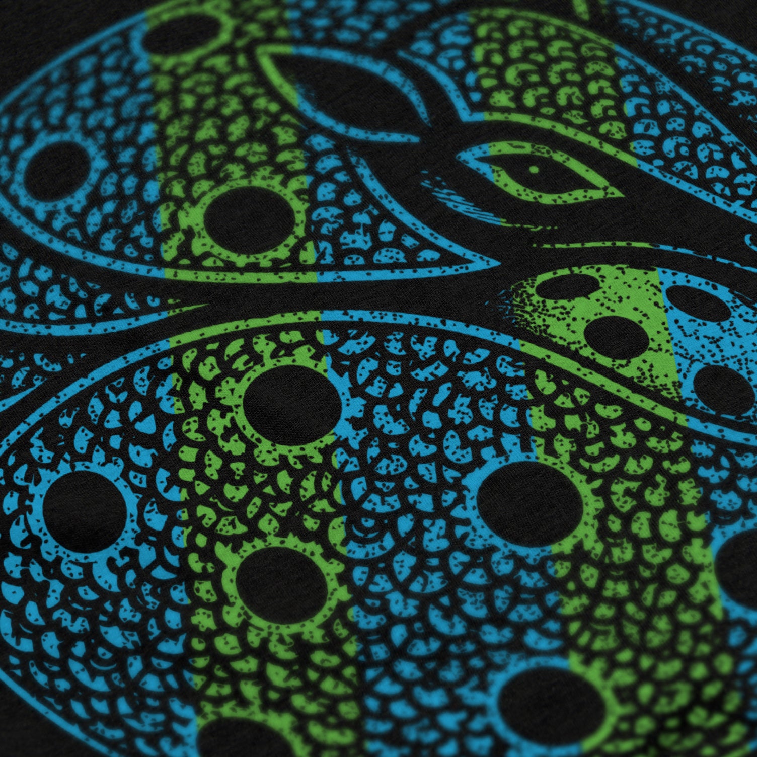 Close-up of Armor pickleball shirt in black – armadillo graphic detail on back
