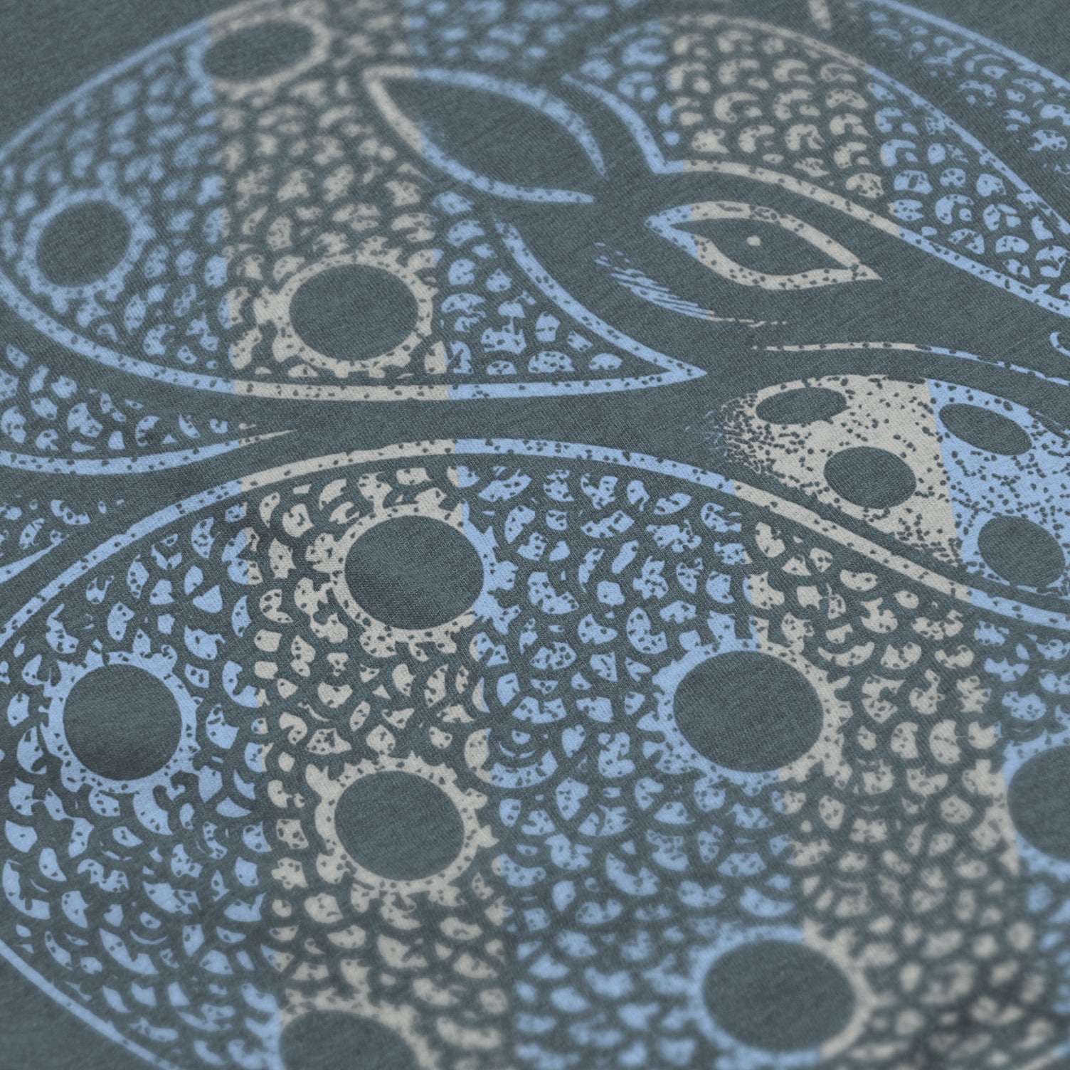 Close-up of Armor pickleball shirt in slate blue – armadillo graphic detail on back