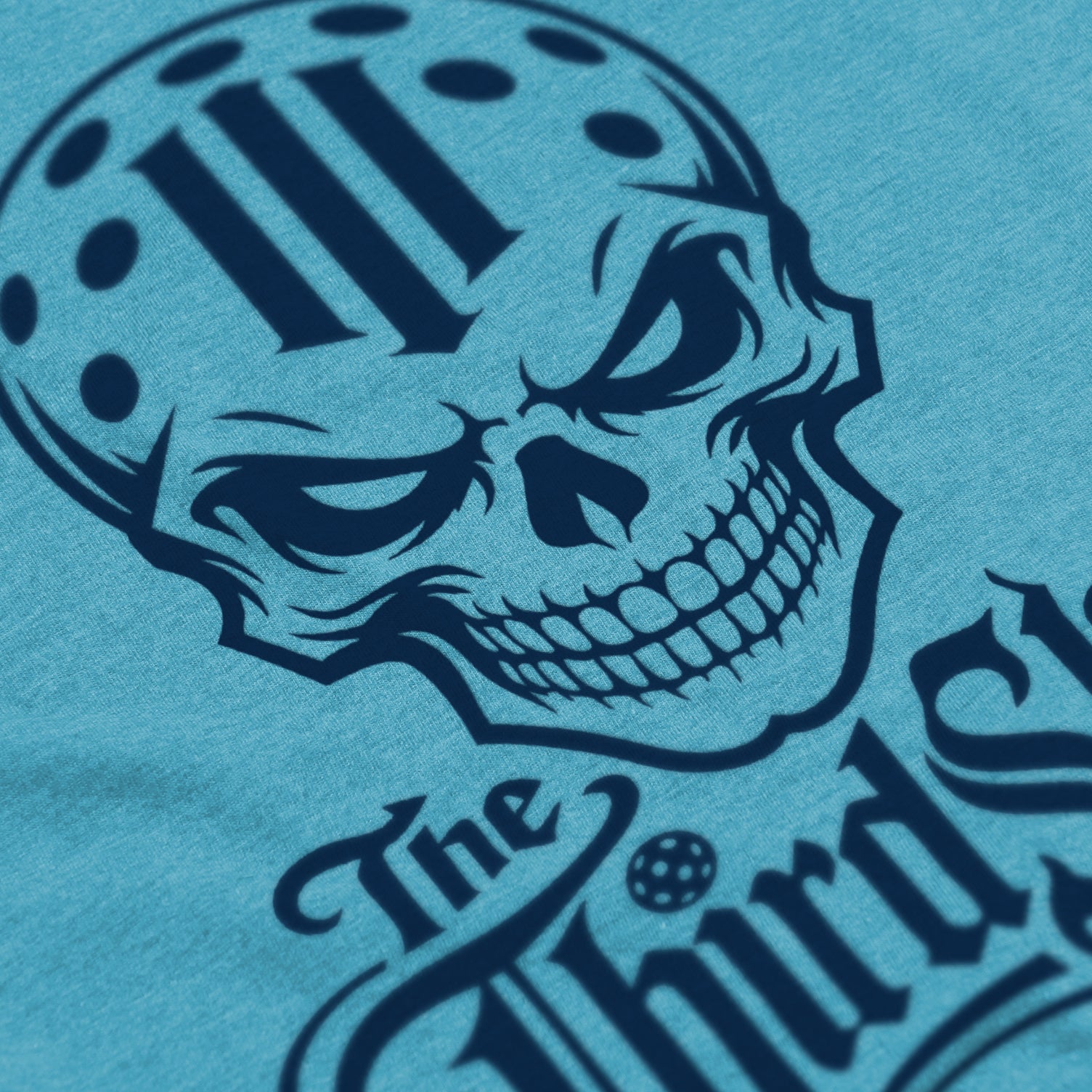 Close-up of Reaper pickleball shirt in Bondi – skull graphic detail on front