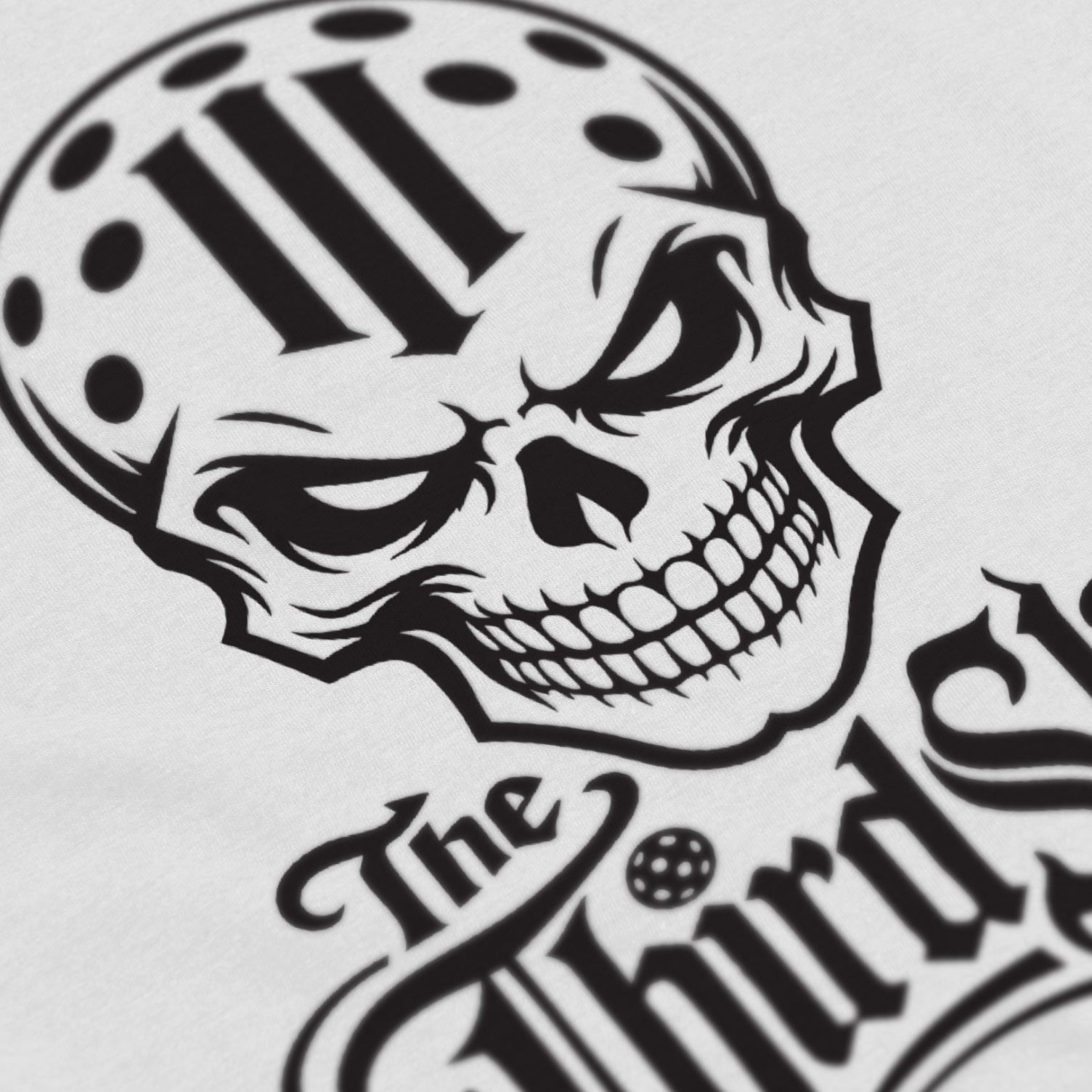 Close-up of Reaper pickleball shirt in white – skull graphic detail on front